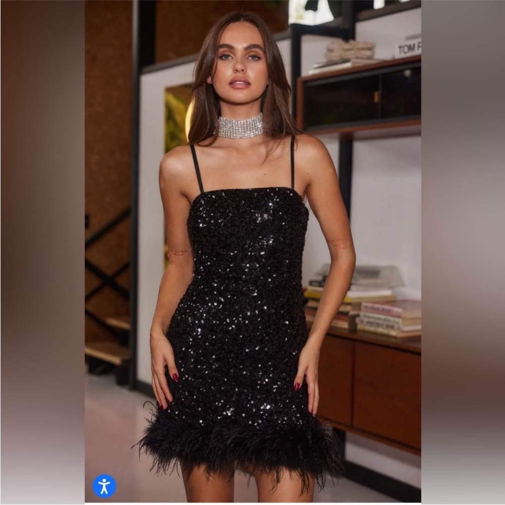 Black sequin mini dress with feather bottom